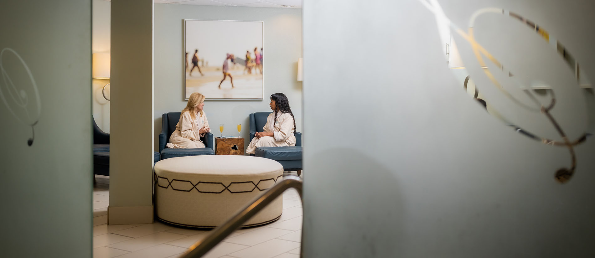 Two women sitting in the spa lounge at Serenity by the sea Spa in Destin, Florida.