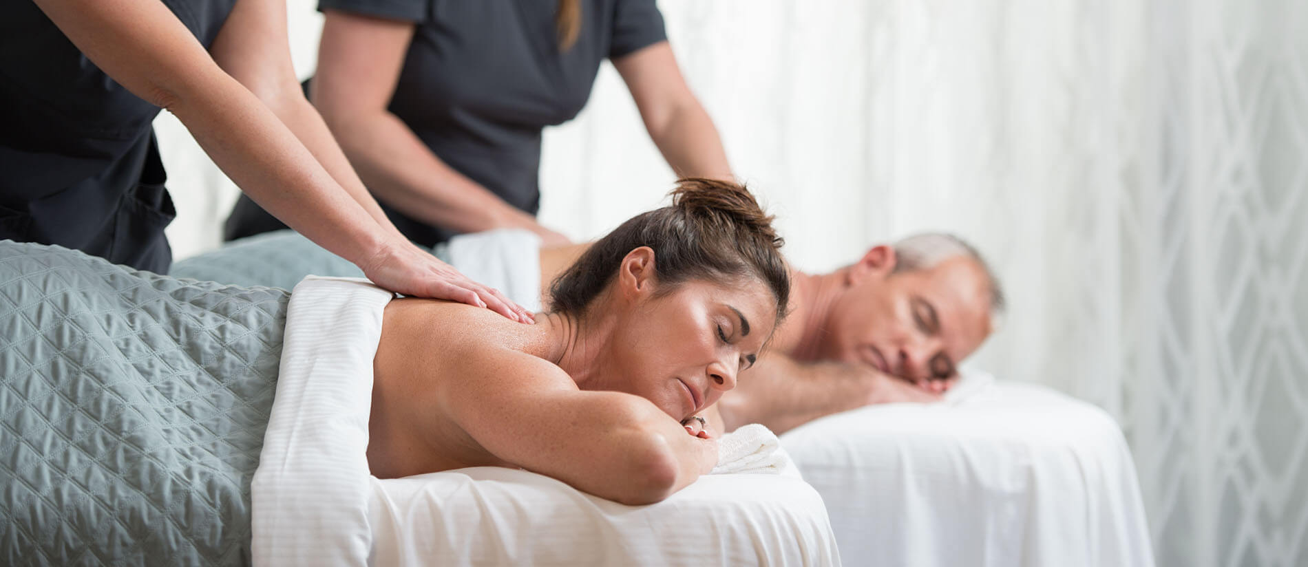 couple enjoys a romantic couples massage at one of the best spas in Florida for couples