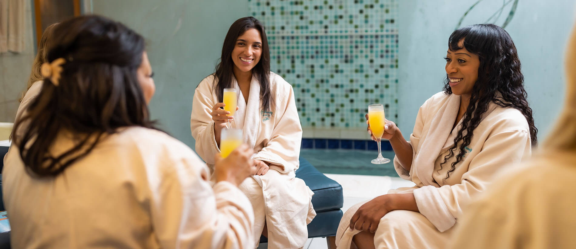 Women enjoying mimosas during their Destin Spa day at Serenity.